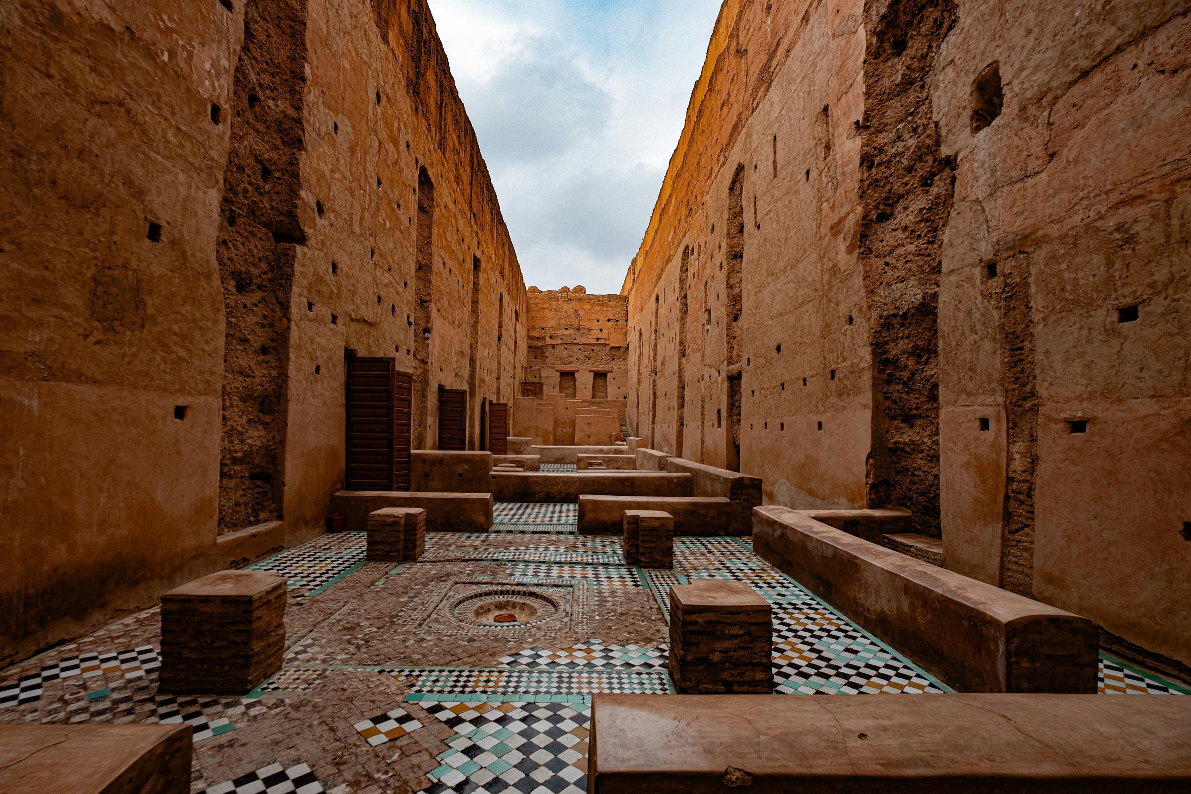 The earthen walls and tiled floor of the El Badi palace in Marrakech
